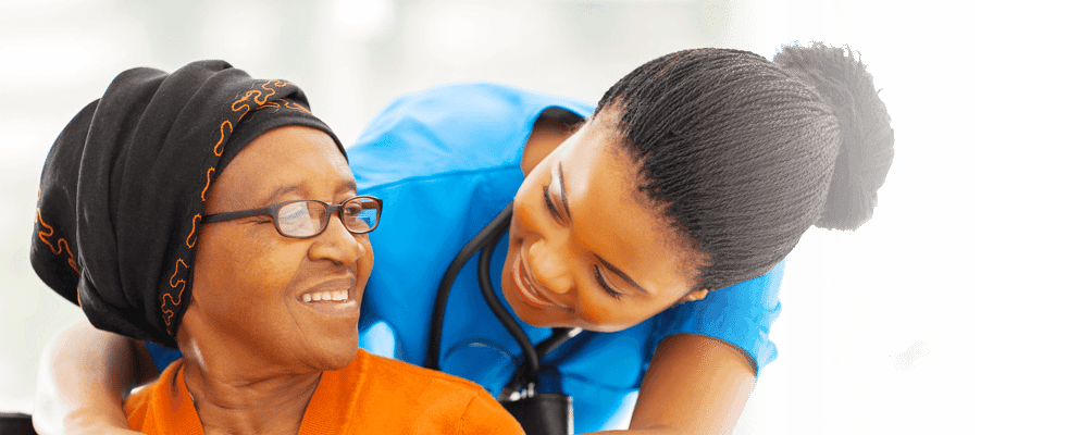 Caregiver interacting with a smiling resident