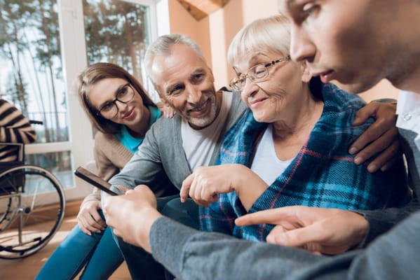 Residents and staff engaged in a joyful moment together