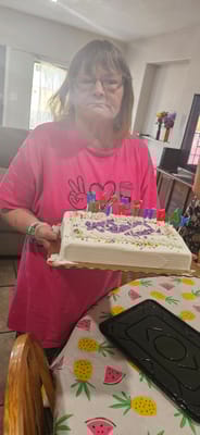Resident celebrating with a birthday cake