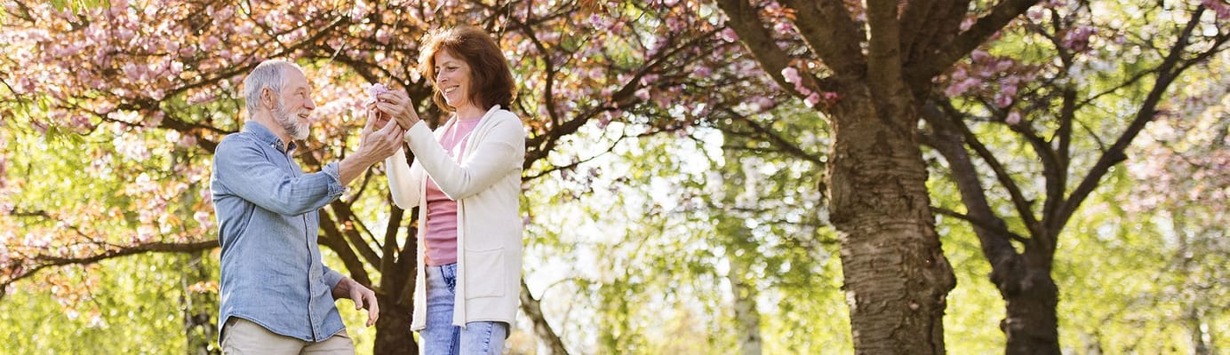 Residents enjoying time in a blooming outdoor garden