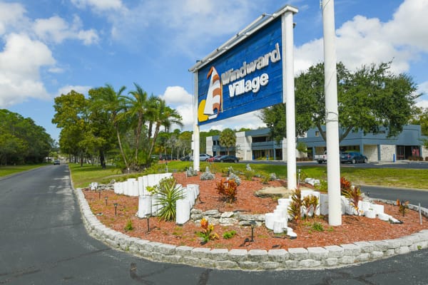 Facility logo sign in front of Windward Village Community