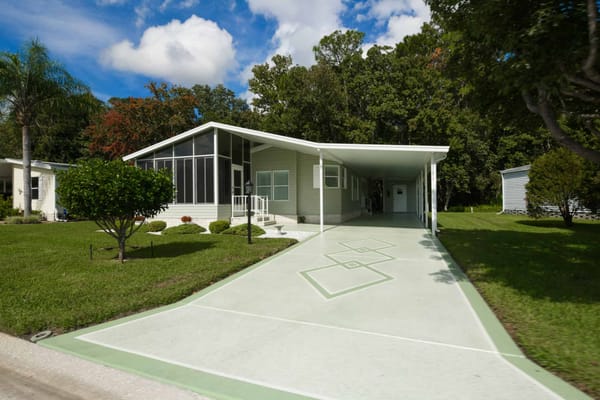 Exterior view of a building with landscaping and driveway