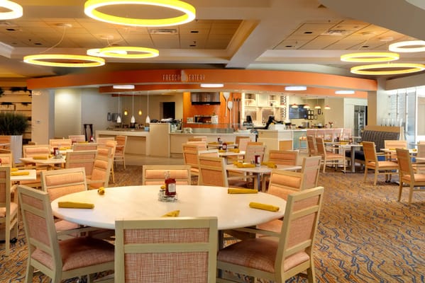 Bright dining area with modern decor and seating