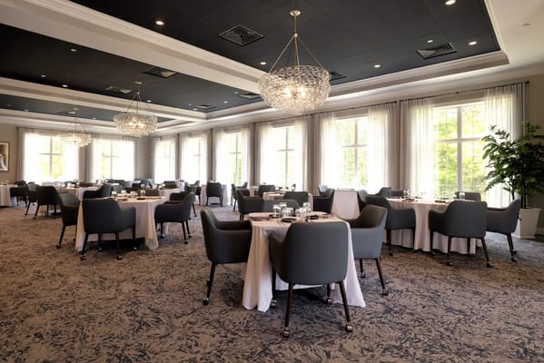 Elegant dining room with chandeliers and tables