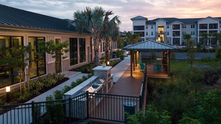 Outdoor patio with seating and BBQ area