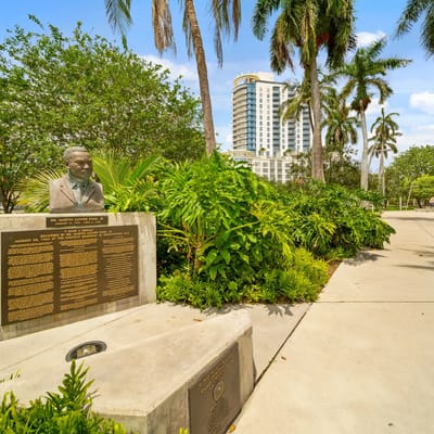 Outdoor area with a statue and building in the background