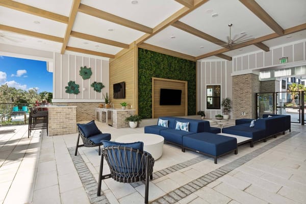 Bright common area with modern seating and greenery