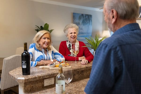 Residents enjoying snacks and drinks in a cozy setting