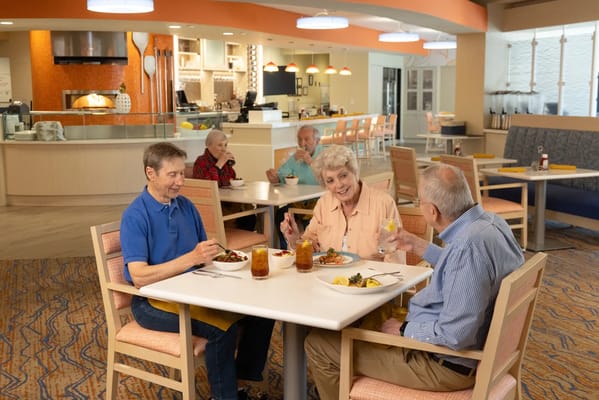 Residents enjoying a meal in the dining area