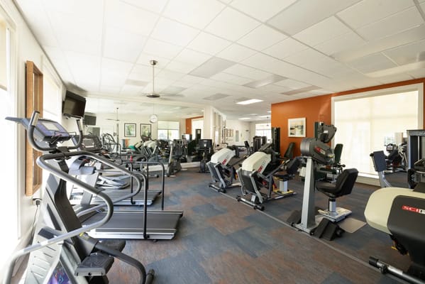 Fitness room with exercise equipment and machines