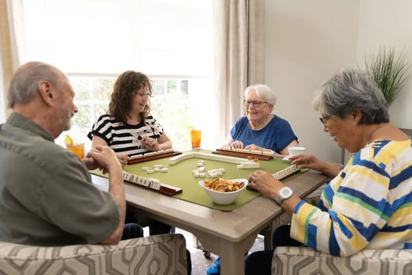 Residents enjoying a game of mahjong in a communal area