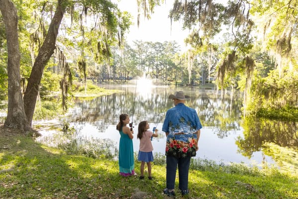 People enjoying a serene lakeside view at the facility