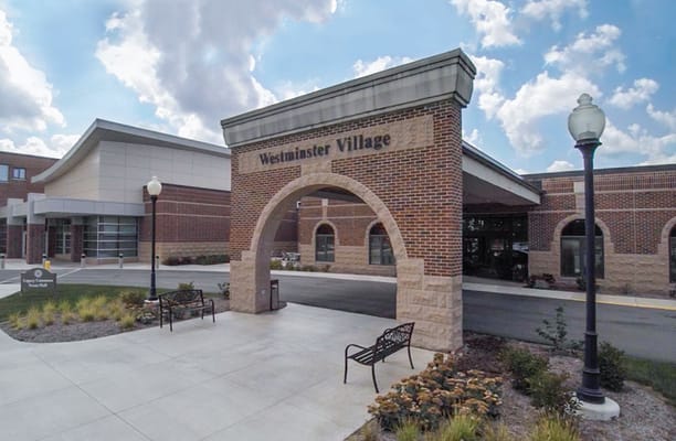Facade of Westminster Village entrance with archway