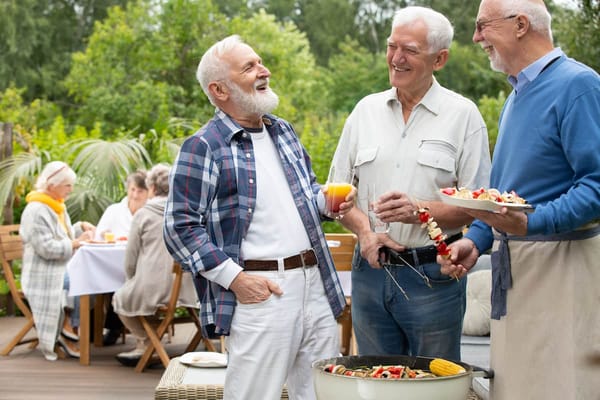 Residents enjoying a barbecue in an outdoor space