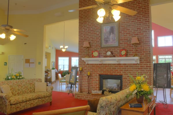 Cozy common area with comfortable seating and a fireplace