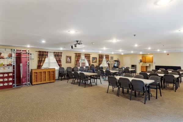 Spacious common area with tables and chairs