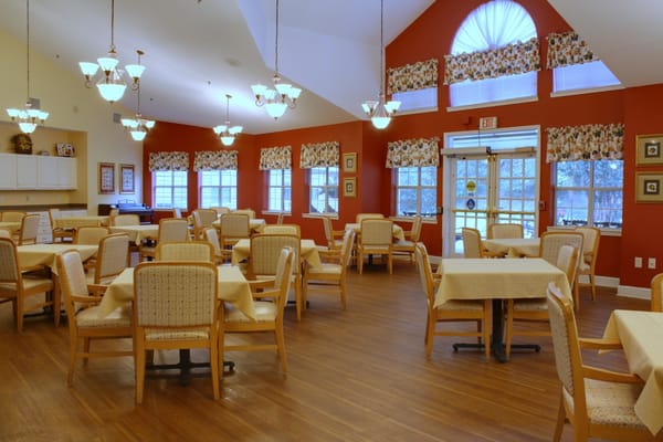 Interior view of a dining room with tables and chairs