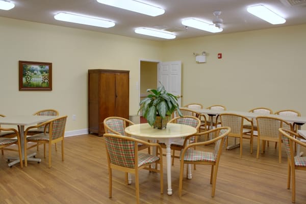Bright common area with tables and chairs