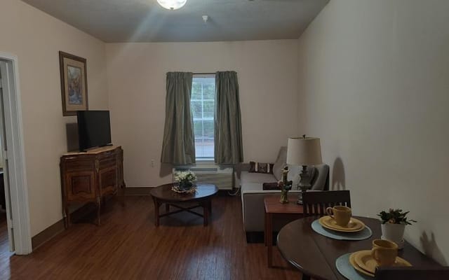 Cozy living room setup in a resident's suite