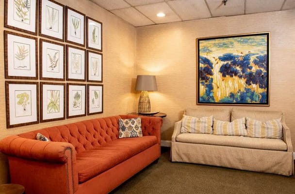 Cozy lounge area with artwork and comfortable seating
