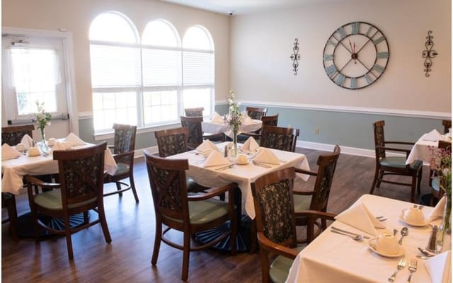 Well-set dining room with tables and chairs
