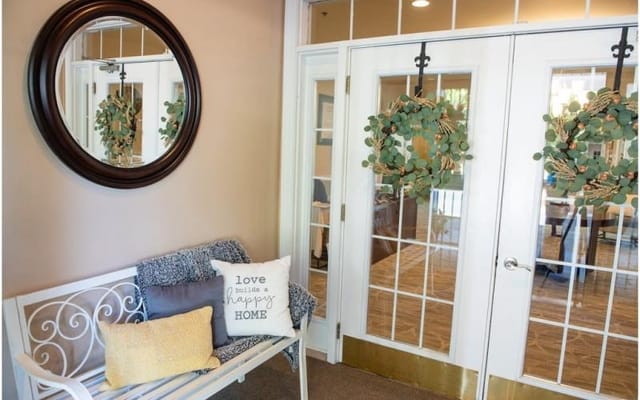 Interior entryway with decorative features and seating
