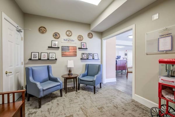 Common area with seating and decorated wall