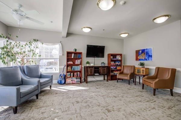 Common area with seating and bookshelves