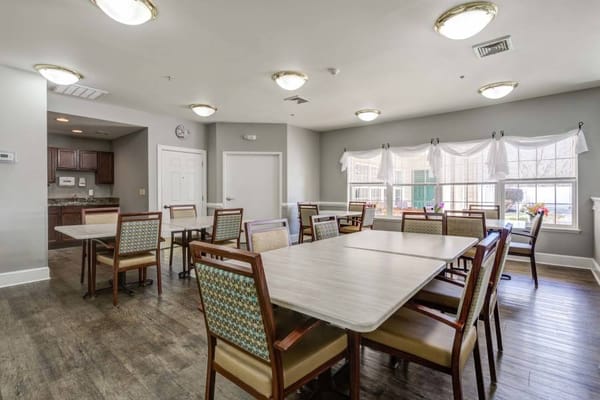 Bright dining room with tables and chairs