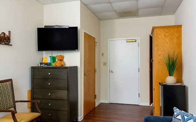 Interior view of a resident room with furniture
