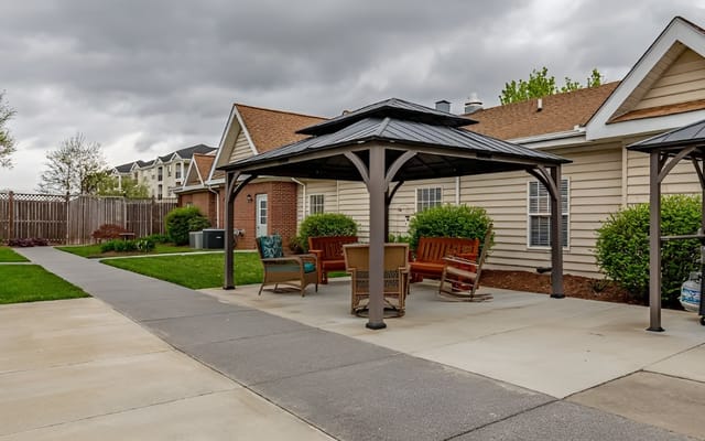 Outdoor seating area with gazebos and landscaping