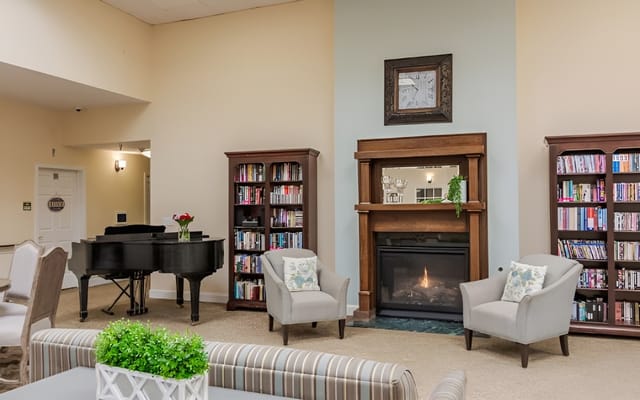Cozy common area with seating and a piano