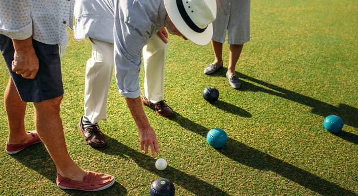 Residents playing lawn bowling on a sunny day