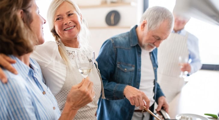 Residents enjoying cooking together in a bright kitchen