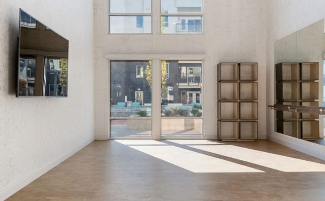 Well-lit common area overlooking an outdoor space