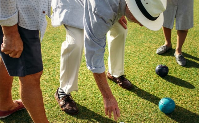 Residents enjoying a game of lawn bowling outdoors