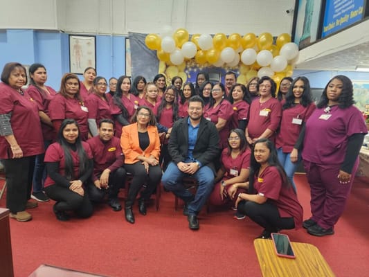 Staff group photo in a common area