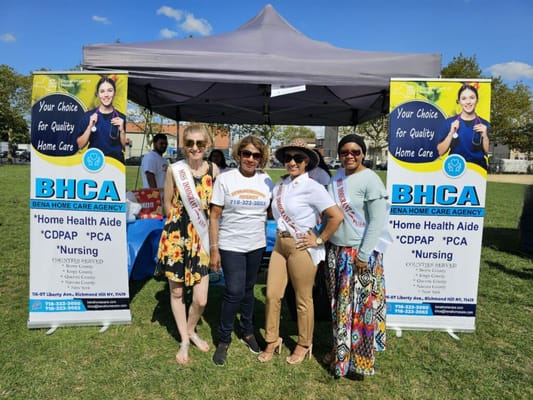 Staff interacting at an outdoor event for Bena Home Care.