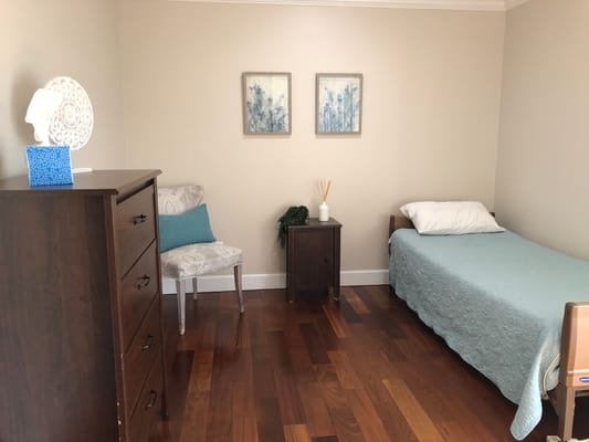 Simple private resident room with wood flooring
