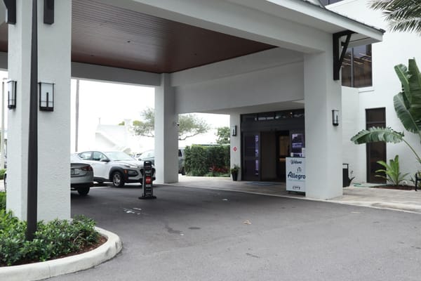 Entrance of Allegro Fort Lauderdale with vehicle parking