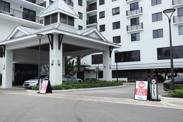 Exterior view of Allegro Fort Lauderdale with valet signs