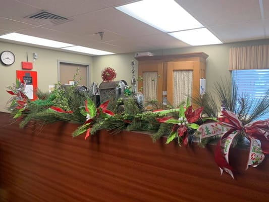 Decorative holiday garland on reception desk