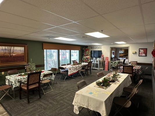 Festively decorated common area with tables and chairs