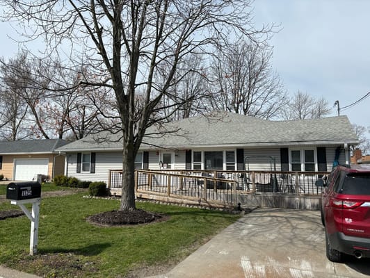 Front view of Live Your Best Life facility with porch and driveway