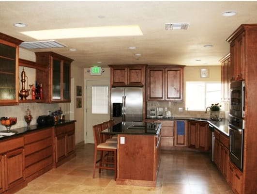 Bright kitchen with wooden cabinetry and modern appliances