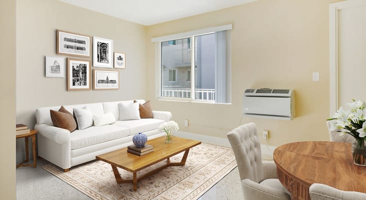 Bright living room with a white sofa and wooden coffee table