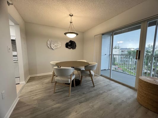 Bright dining area with a view of the outdoor space