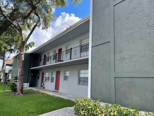 Exterior view of a senior living facility with balconies