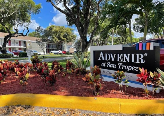 Signage featuring the Advenir at San Tropez logo