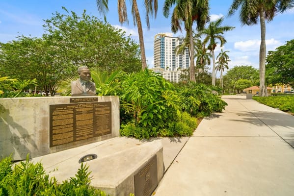 Outdoor park area with landscaping and a statue